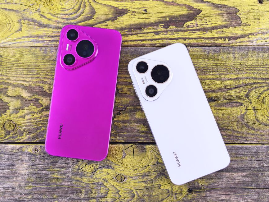 素朴な木の表面に鮮やかな紫と洗練された白のスマートフォンが置かれ、現代のテクノロジーとデザインが披露されています。